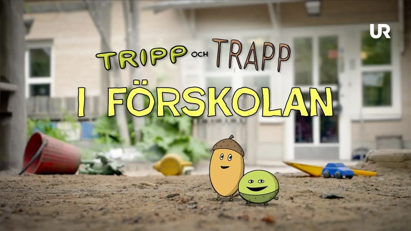 Sandlåda med två illustrerade ekollon.